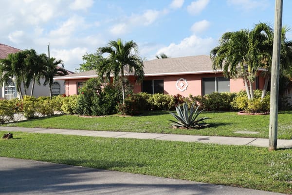 Front exterior of a residential facility with landscaping