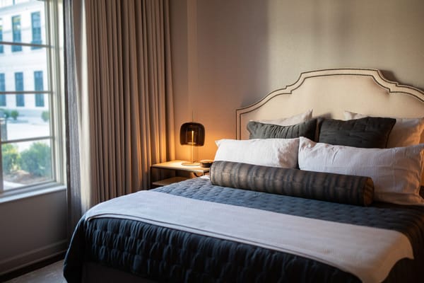 Cozy and well-lit private bedroom with a window