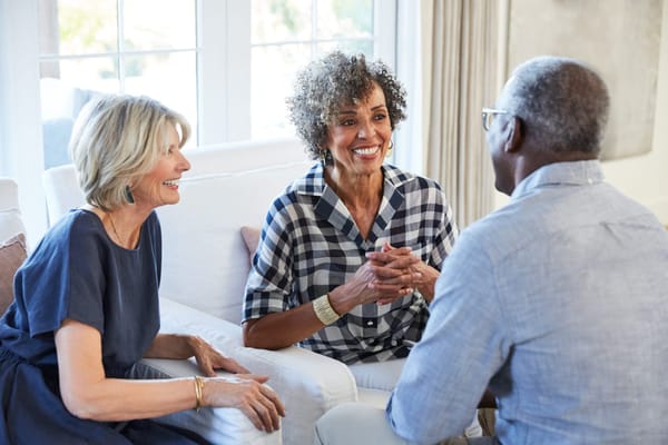 Residents engaged in conversation in a common area