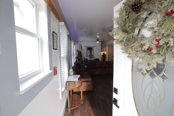 View into a cozy common area decorated for the holidays