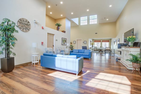 Bright common area with seating and natural light