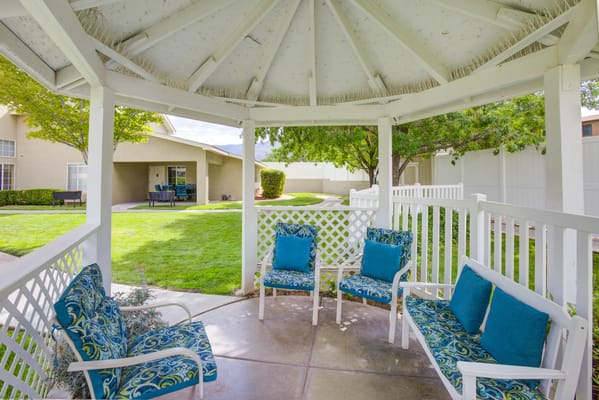 Outdoor seating area in a well-kept garden