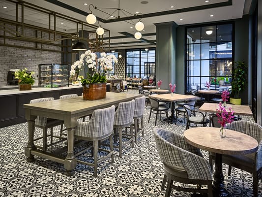 Stylish dining room with seating and floral decor
