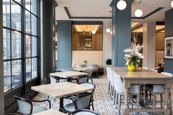 Bright dining area with modern decor and seating