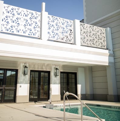 Outdoor pool area with decorative fencing