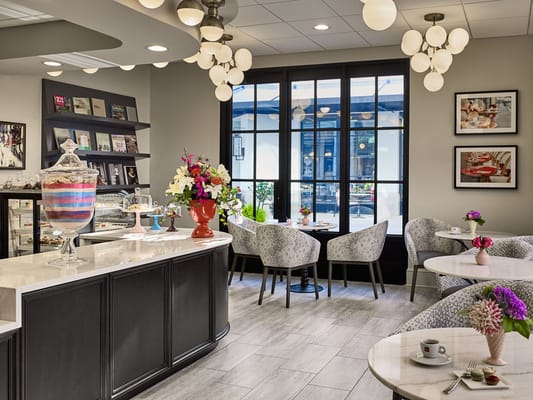 Interior view of a cozy cafe area with seating and decor