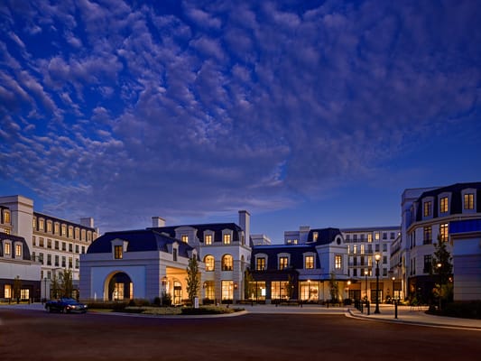 Exterior view of a senior living facility at dusk