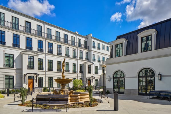 Outdoor courtyard with fountain and seating area