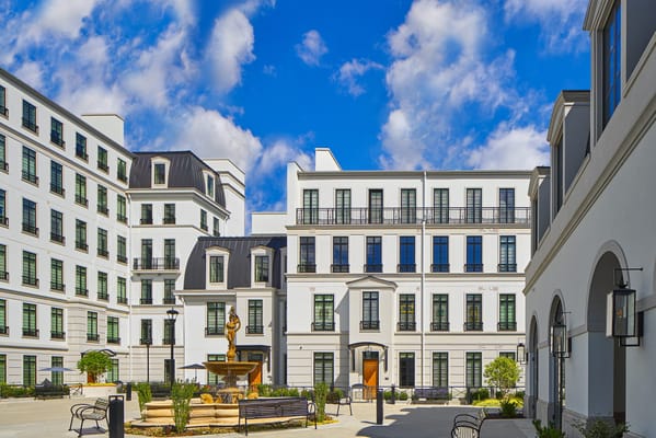 Exterior view of a senior living facility with a courtyard