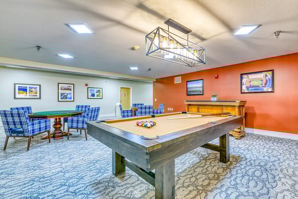 Common area with a pool table and seating