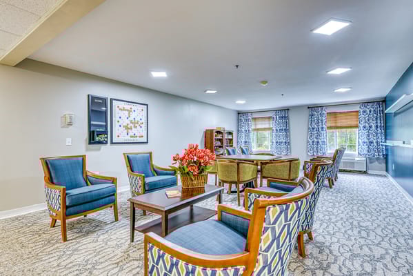 Bright common area with seating and bookshelves
