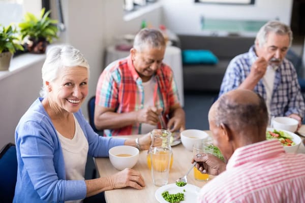 Residents enjoying a meal together in a dining area
