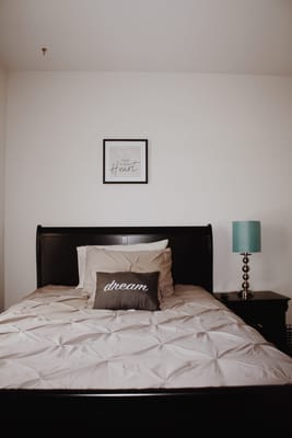 Cozy bedroom with soft bedding and decor