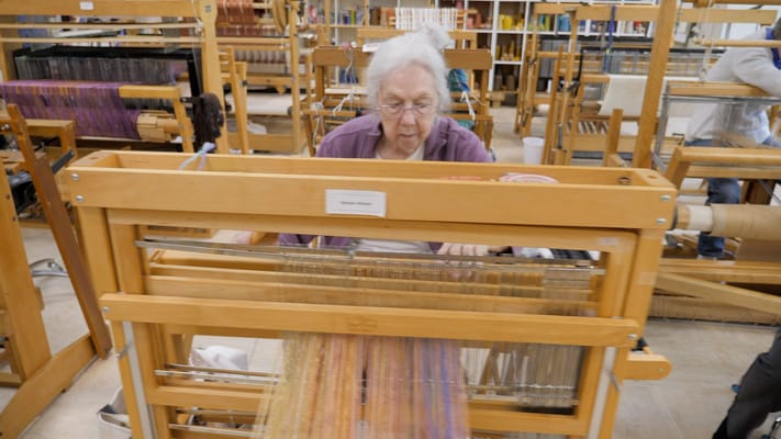 Resident weaving in an activity room