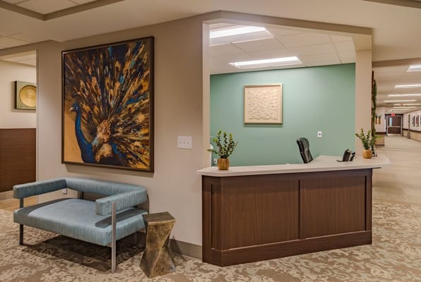 Bright lobby area with peacock artwork