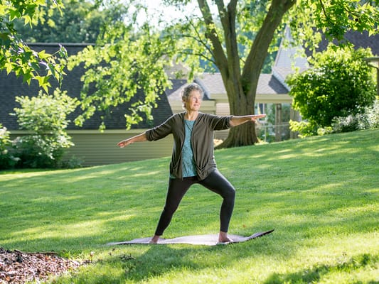 Woman practicing yoga in a peaceful outdoor space