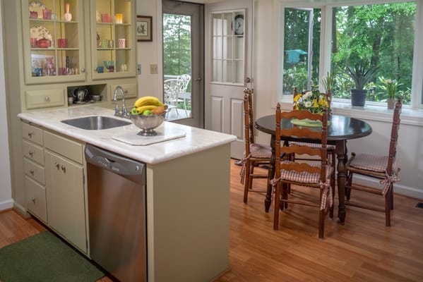 Bright kitchen and dining area with outdoor view