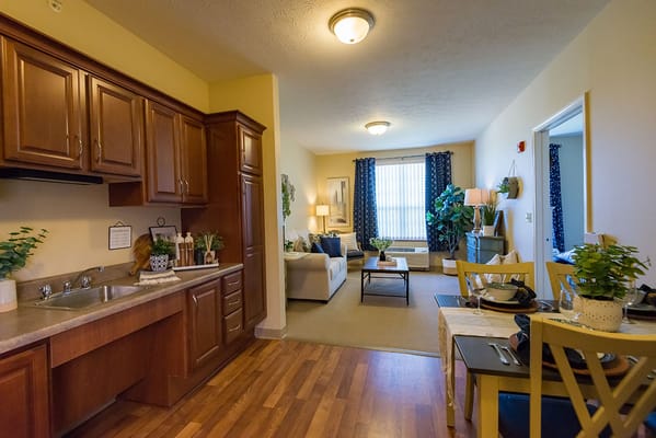 Cozy interior view of a resident unit with kitchen and living area
