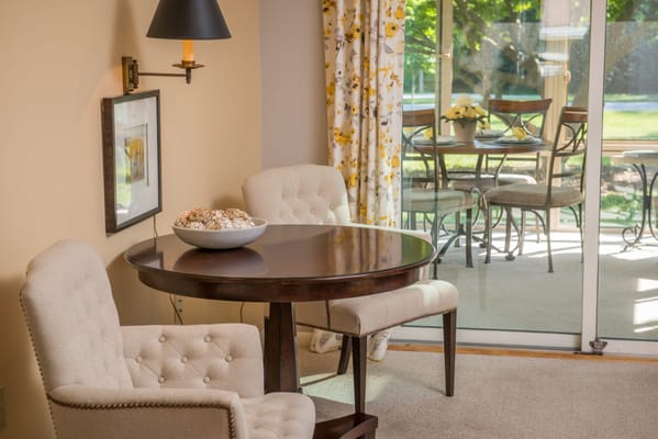 Bright common area with a dining table and outdoor view
