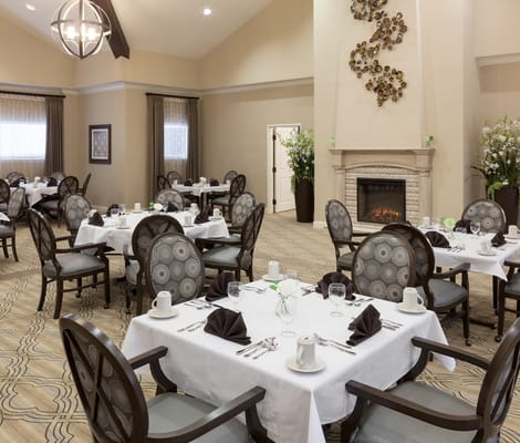 Elegant dining room with tables set for a meal