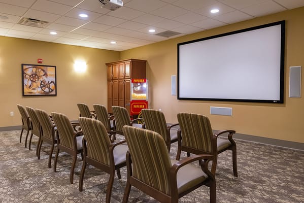 A cozy movie room with comfortable seating