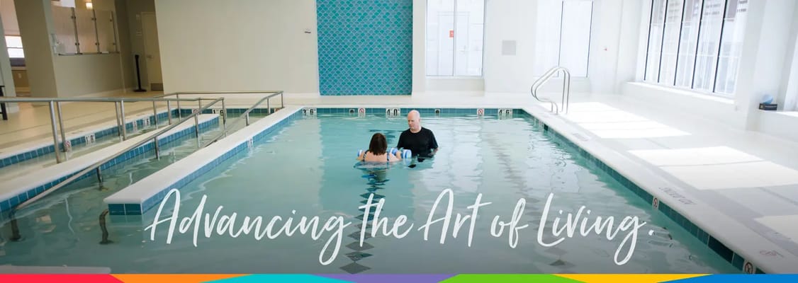 Two people in an aquatic therapy pool