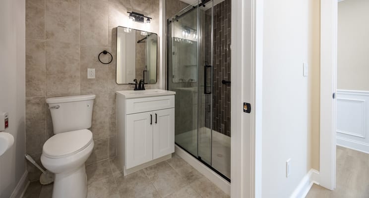 Modern bathroom interior with shower and vanity