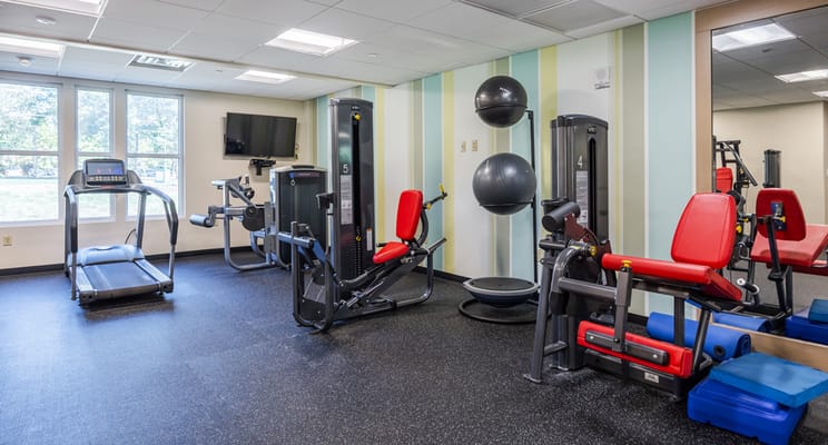 Interior view of a fitness area with exercise equipment