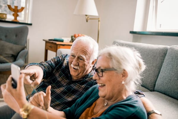 Seniors enjoying a moment together in a cozy living room
