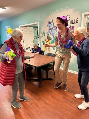 Residents and staff celebrating with fun activities