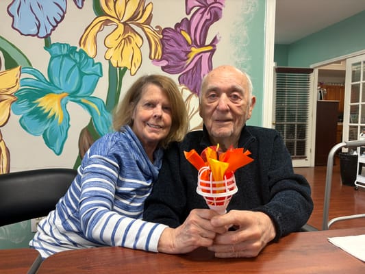 Residents enjoying an activity with colorful decorations