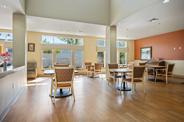 Bright common area with seating and natural light