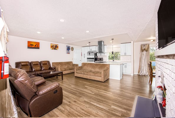 Bright common area with seating and kitchen space
