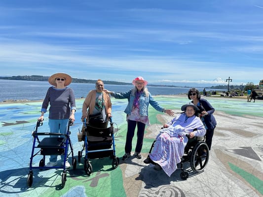 Residents enjoying a sunny day by the water