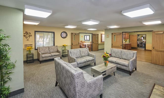 Common area with seating and decor in a residential facility