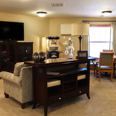 Common area with seating and television in a cozy interior