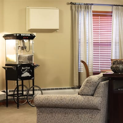 Interior view with popcorn machine in a cozy common area