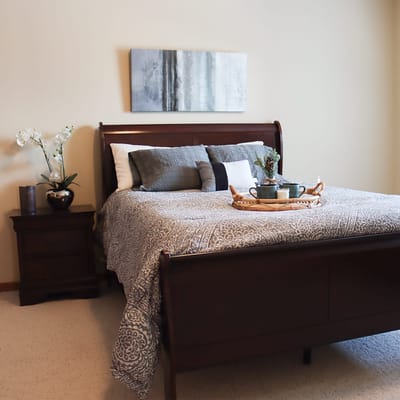 Cozy bedroom with a neatly made bed and decor