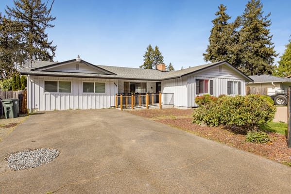 Exterior view of a senior living facility with garden