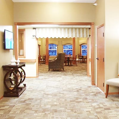 Common area with seating and tables in a warm interior