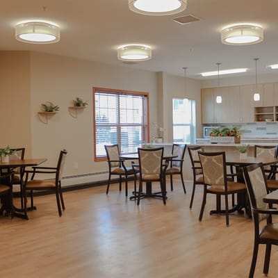 Bright dining area with tables and chairs
