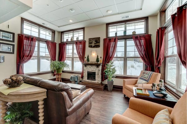 Cozy common area with large windows and comfortable seating