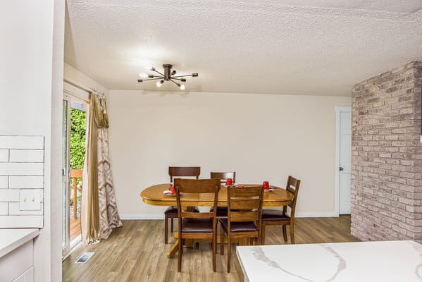 Dining area with wooden table and chairs