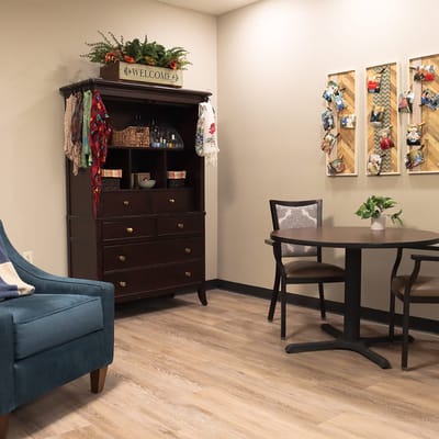 A cozy common area with a welcome sign and furnishings