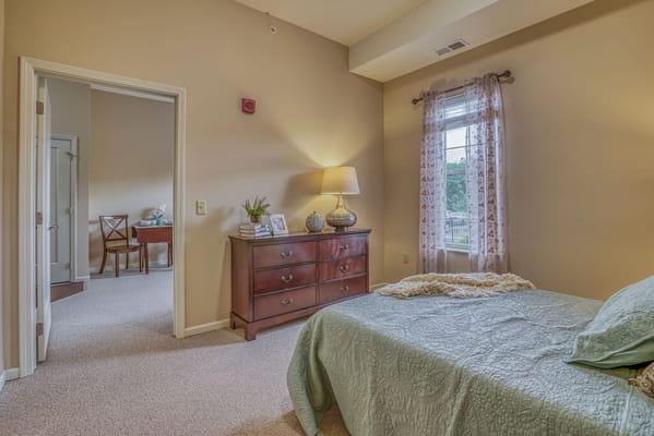 Cozy interior of a private resident room with a window