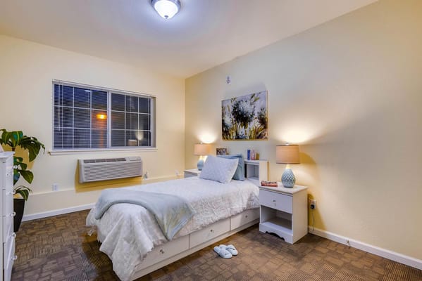 Cozy private resident room with a bed and decor