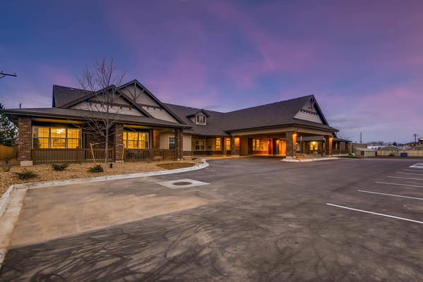Exterior view of Rocky Mountain Assisted Living facility at dusk