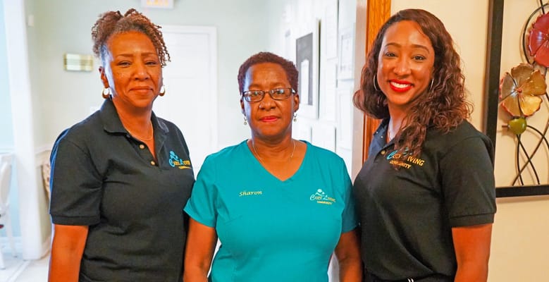 Staff members posing in a hallway