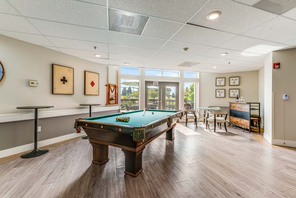 Interior common area with a pool table and seating