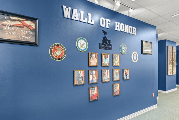Wall of honor with military service recognition pictures